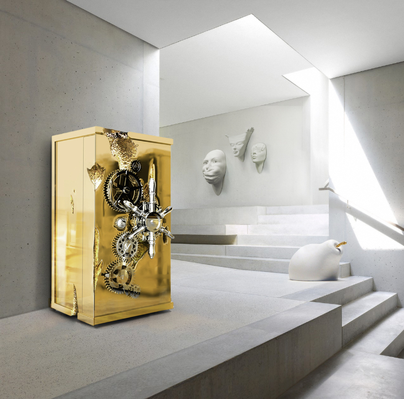 A gold luxury safe is the star of this all white entryway