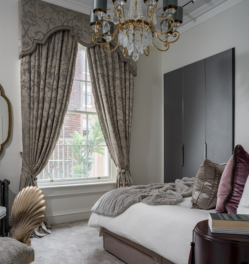 a royal and classic master bedroom with a press vibe and bespoke furniture