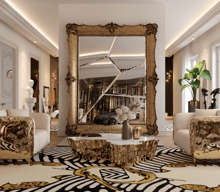 one of the most amazing mirrors, a antique gold mirror, golden center table and grey armchairs with golden details, luxury rug with a pattern white, black and yellow