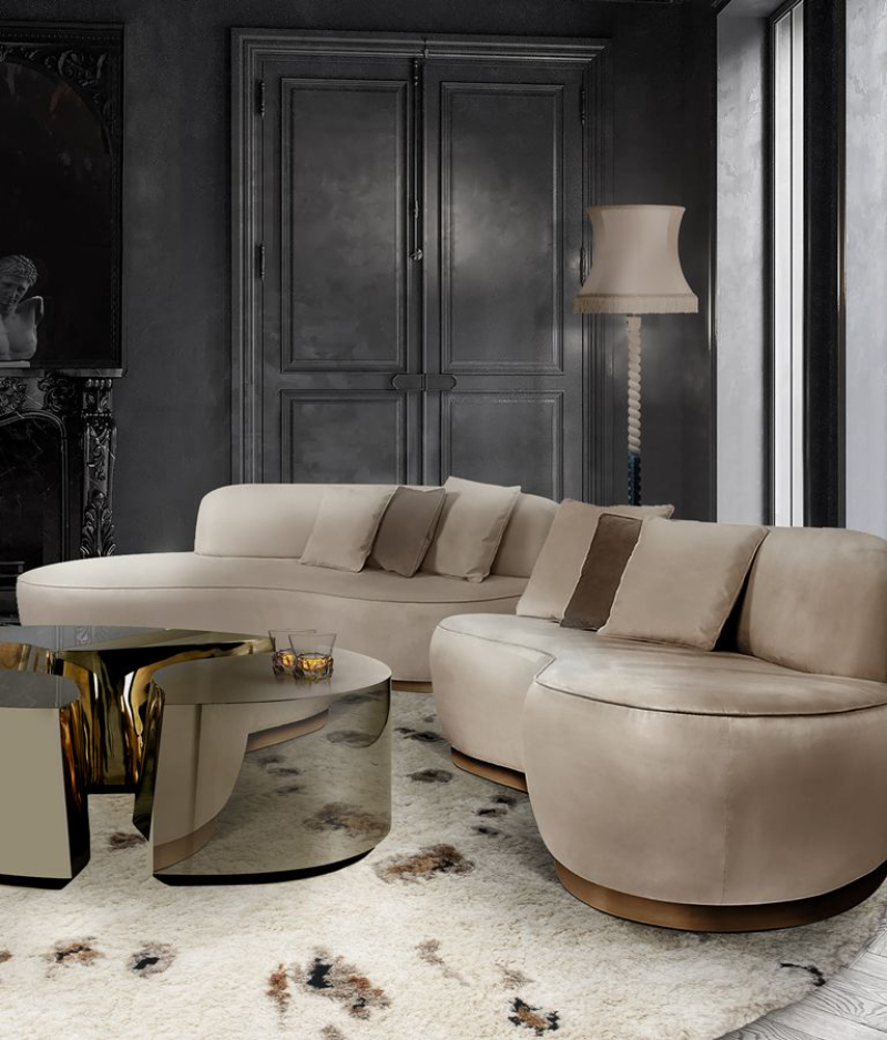 two nude velvet sofas with a mirrored center table