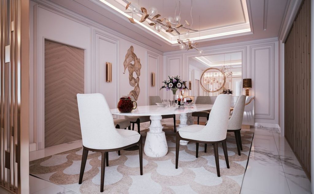 luxury dining room with a marble dining table, a awhite and gbold sideboard and cream chairs