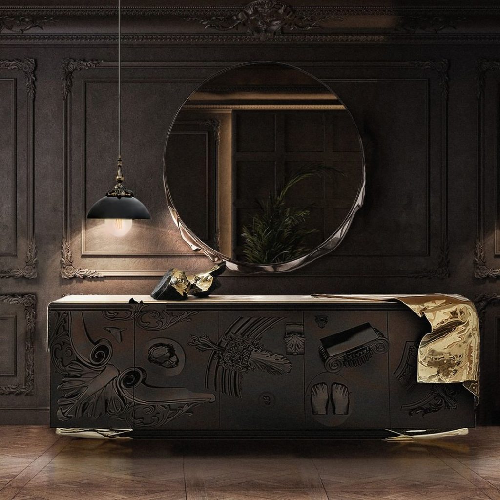 Sideboards - dark entryway with a black sideboard with golden details, a round mirror and a black suspension lamp