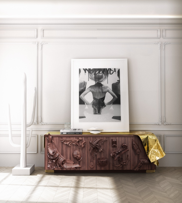 Sideboard - Walnut sideboard with gold details and paint on top in a bright room