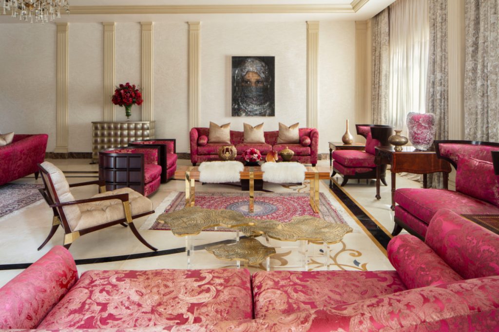 Sumptuous Palace - pink living room with a golden center table