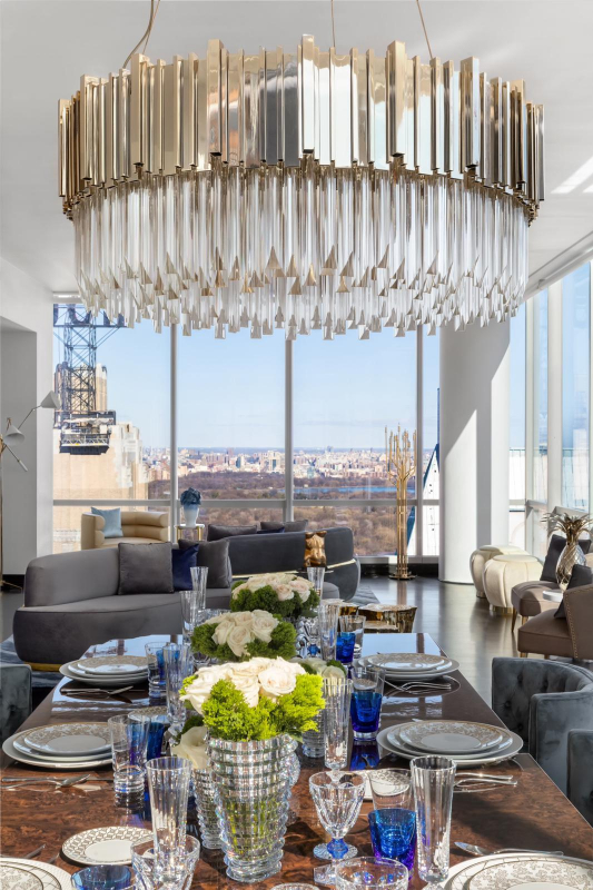 penthouse - modern chandelier and a brown dining table, grey sofa, grey chairs