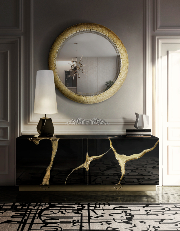 black and gold - luxury entryway with a black and gold sideboard, a round golden mirror and a black and white table lamp