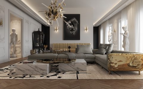 luxury living room with a marble center table, a grey modular sofa with gold brass details, a luxury chandelier and a gold sideboard
