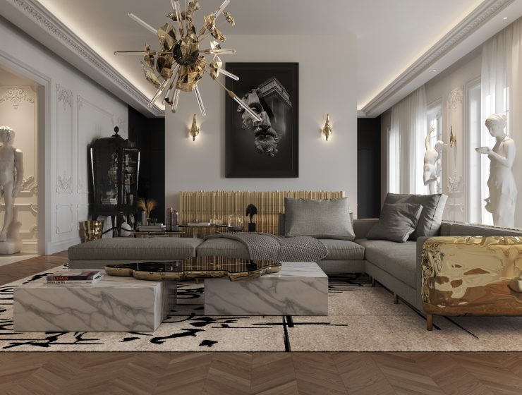 luxury living room with a marble center table, a grey modular sofa with gold brass details, a luxury chandelier and a gold sideboard
