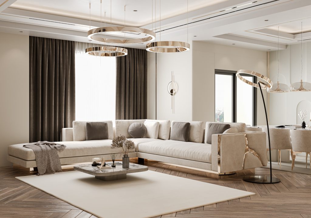 Luxury Home in L.A | Where Opulence Meets Elegance- modern living room, white and brown curtains, cream sofa with gold details, cream rug, coffee table with decorative items and plants, gold hanging lamp