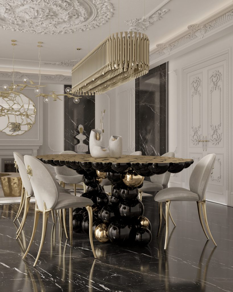 Gold and Black: Dining Area with Gold and Black Accents: A grand dining room with a long black marble table surrounded by black upholstered chairs with gold detailing. A stunning gold chandelier hangs above, illuminating the space. The walls are adorned with intricate gold patterns, adding to the luxurious atmosphere.