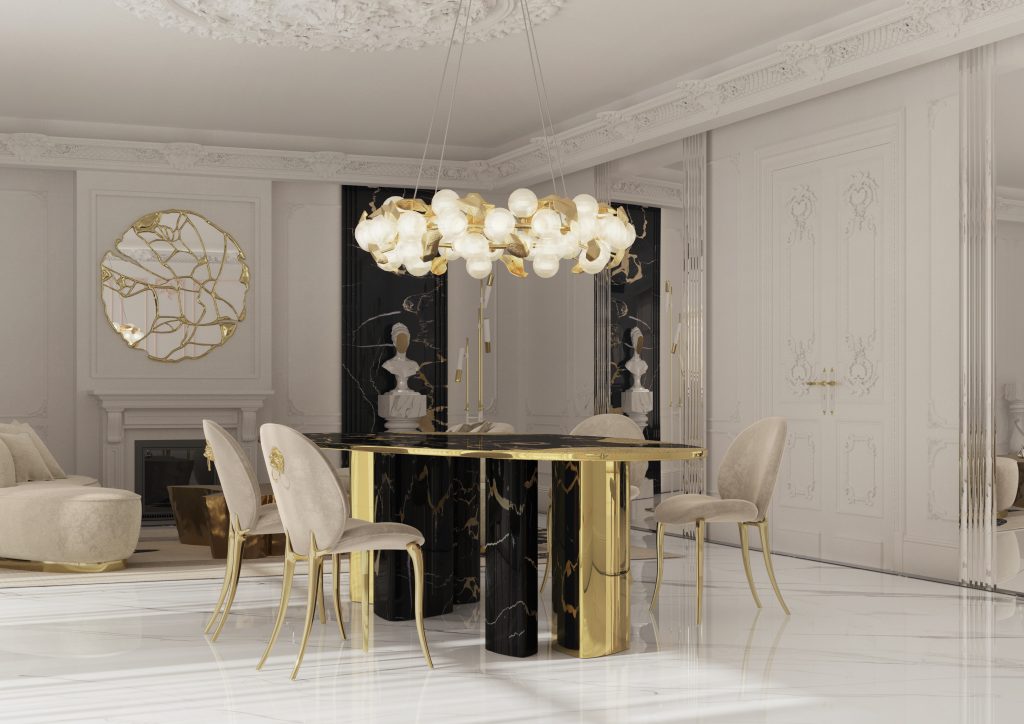 bright dining room with black and gold dining table and beige dining chairs