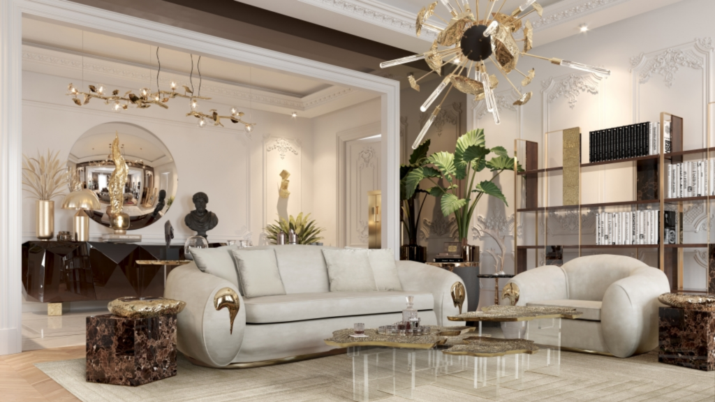 premium furniture piece- Luxurious living room with a beige color palette and gold accents. The space features a plush cream sofa and armchair with metallic gold details, complemented by marble and glass coffee tables. A large, artistic chandelier with gold and black elements hangs from the ornate ceiling. In the background, there’s a console table with decorative sculptures and a round mirror, as well as built-in shelves filled with books and decor. Large green plants add a touch of freshness to the elegant, classical interior design.