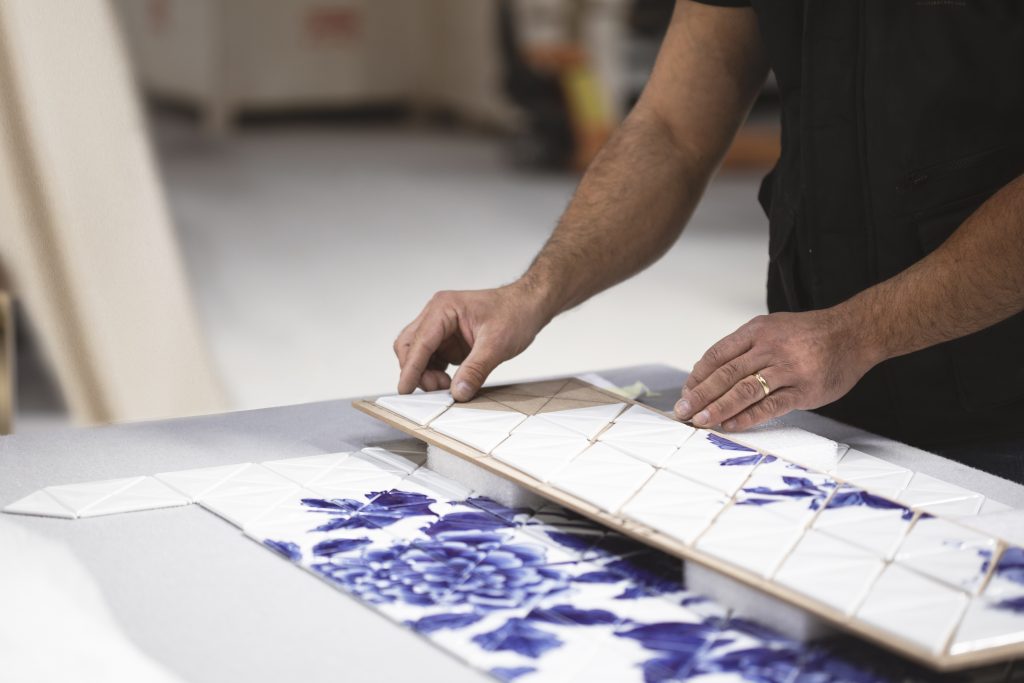 Close-up of the Heritage Cabinet craftsmanship process, highlighting detailed European artisanal techniques and luxurious materials.