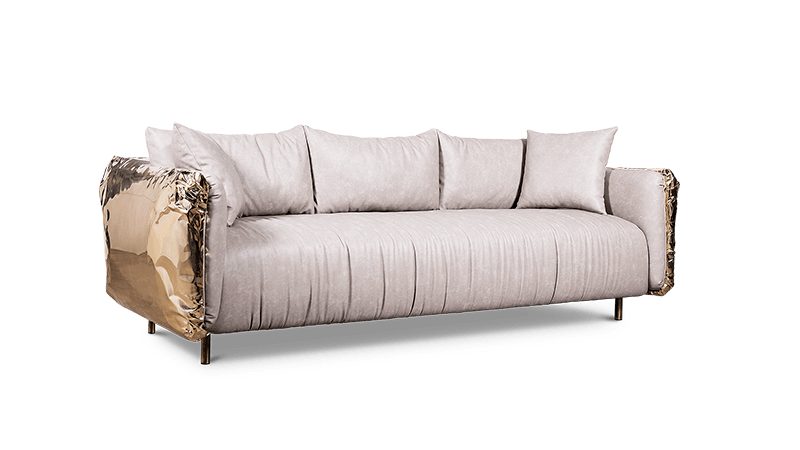 Luxury interior design, white background, a beige sofa with gold detailing and legs