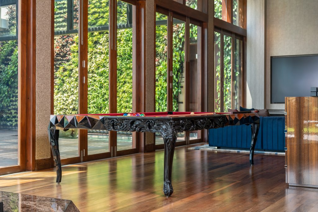 Luxury Residence in Sri Lanka, luxury billiards table with handcrafted details in a bright entertainment space