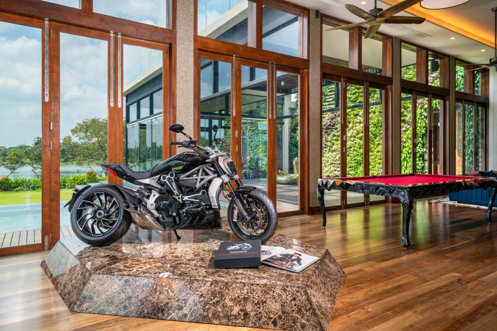 Luxury Residence in Sri Lanka, modern leisure space with designer snooker table, wooden floors and large glass windows