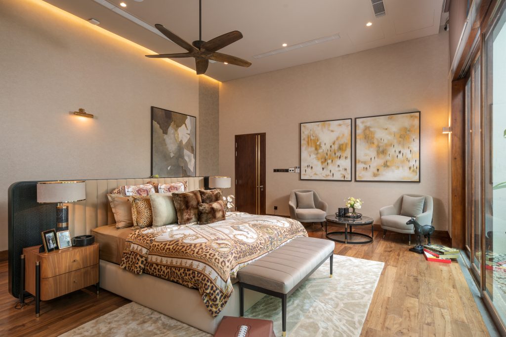 Luxury Residence in Sri Lanka, contemporary bedroom with warm tones, upholstered bed and elegant seating area