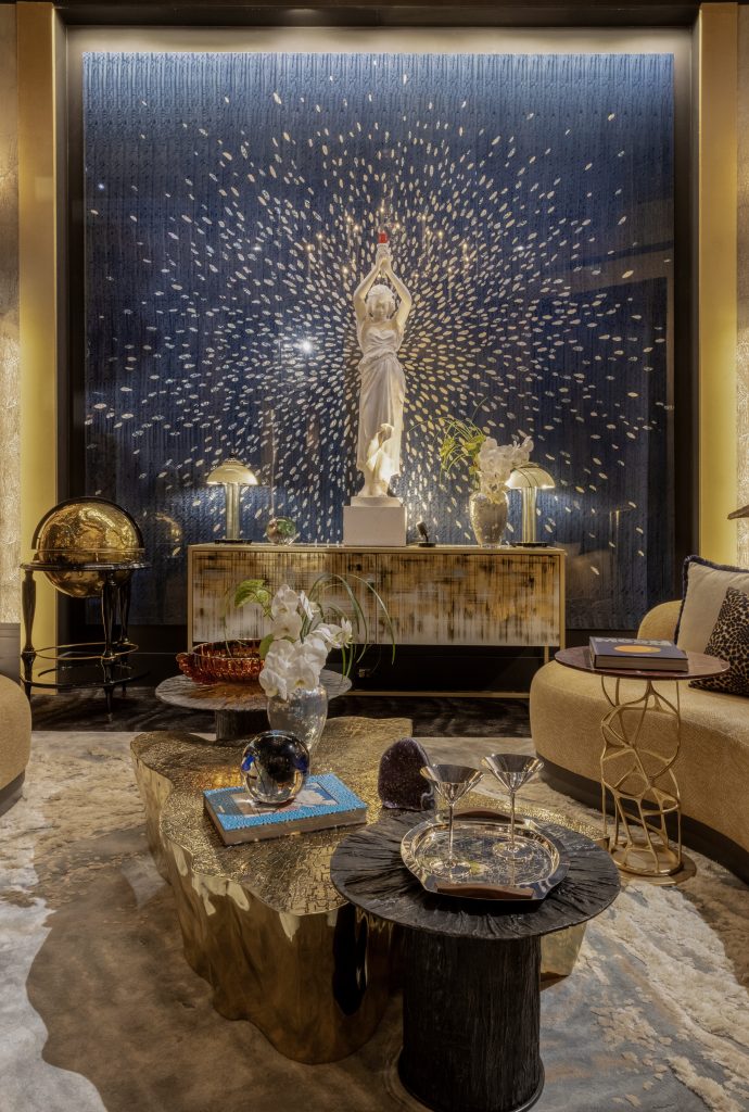 gold center table, cream sideboard, white statue, blue walls, cream sofa, milan design week