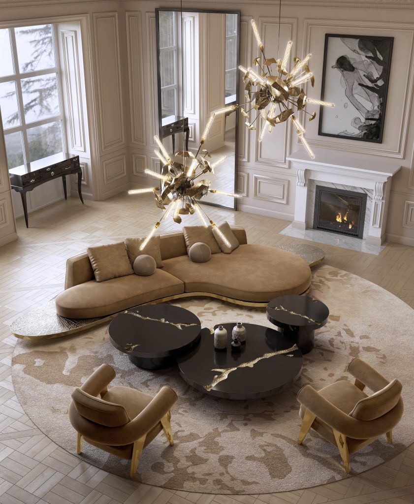 beige wall, brown sofa, black and gold center table, beige rug, brown and gold armchair, fireplace, wall mirror, window, modern armchair