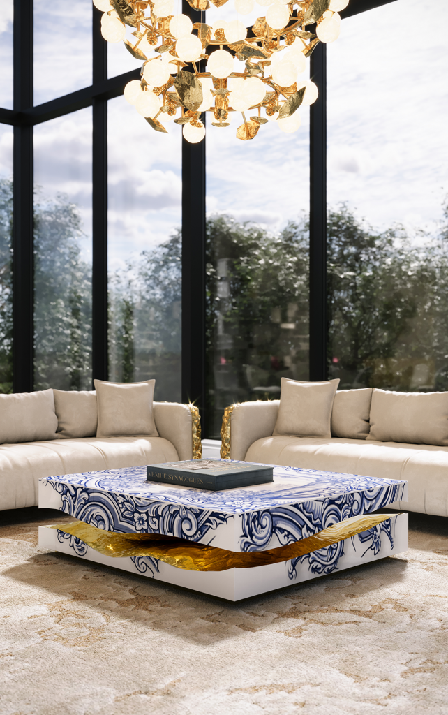 Modern living room featuring two grey sofas with gold metallic armrests and a square coffee table decorated with blue and white traditional tile patterns and a gold interior., Quarry Tiles Center Table