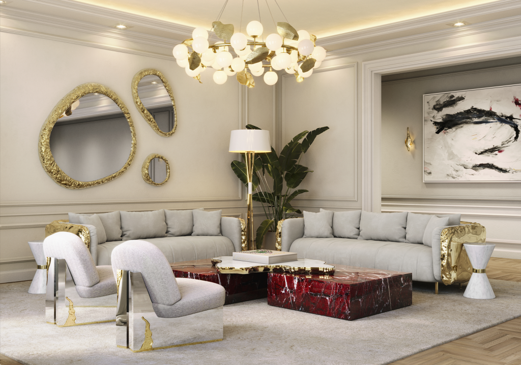 Sophisticated living area with grey sofas, organic-shaped gold mirrors, and a large red marble coffee table, Levanto Rosso Marble