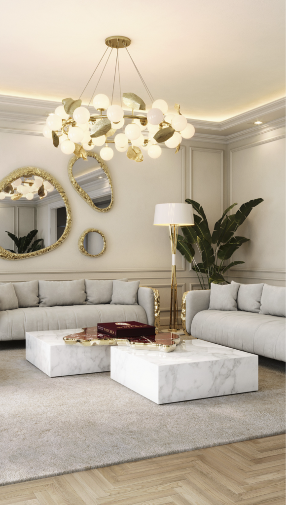 Elegant living room detail showing a white and red marble coffee table set under a bubble-glass chandelier, Levanto Rosso Marble
