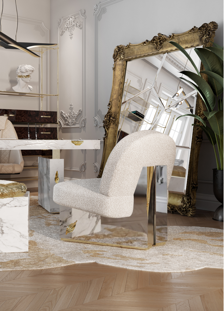 white walls, gold wall mirror, silver and white armchair, white desk, modern armchairs, beige rug, modern armchair