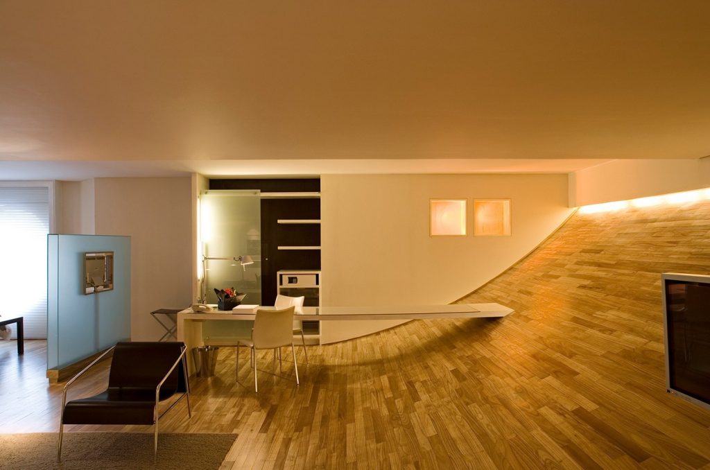 Hotel suite home office nook with wood paneled wall and glass partition – melhores hoteis em sao paulo
