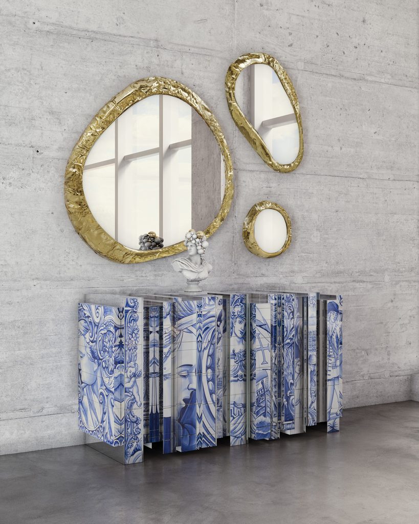 Contemporary entryway featuring Boca do Lobo’s Heritage Sideboard with blue-and-white azulejo-inspired details, paired with sculptural gold mirrors.