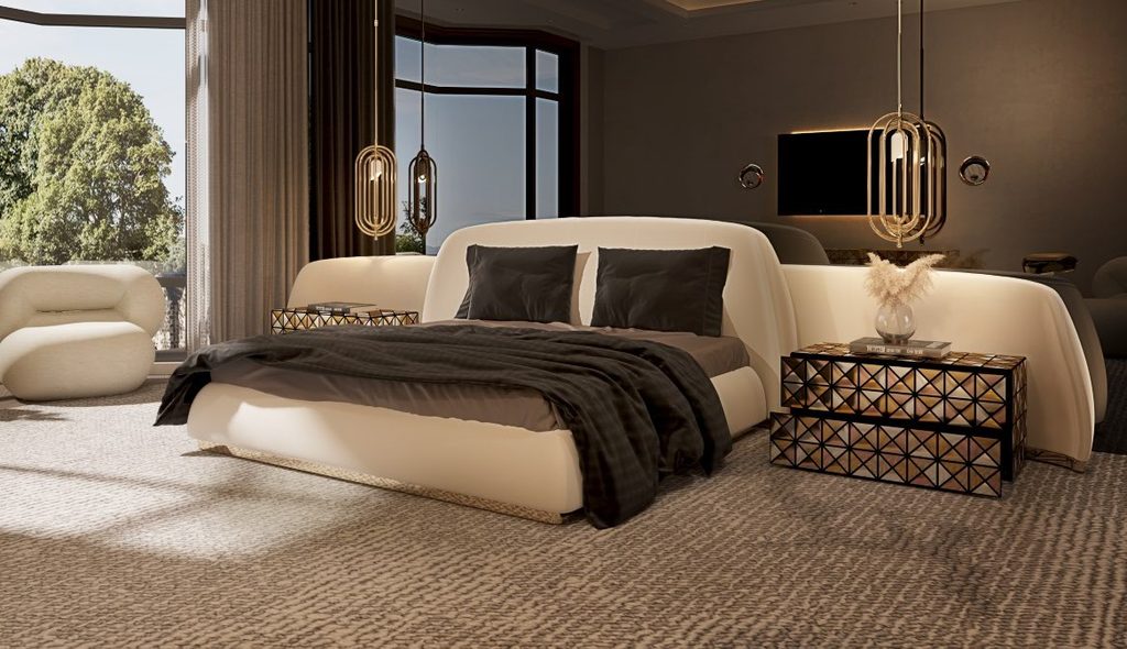 Contemporary luxury bedroom featuring the sculptural Odette Bed, geometric Pixel Nightstands, gold pendant lighting, and expansive windows overlooking greenery.