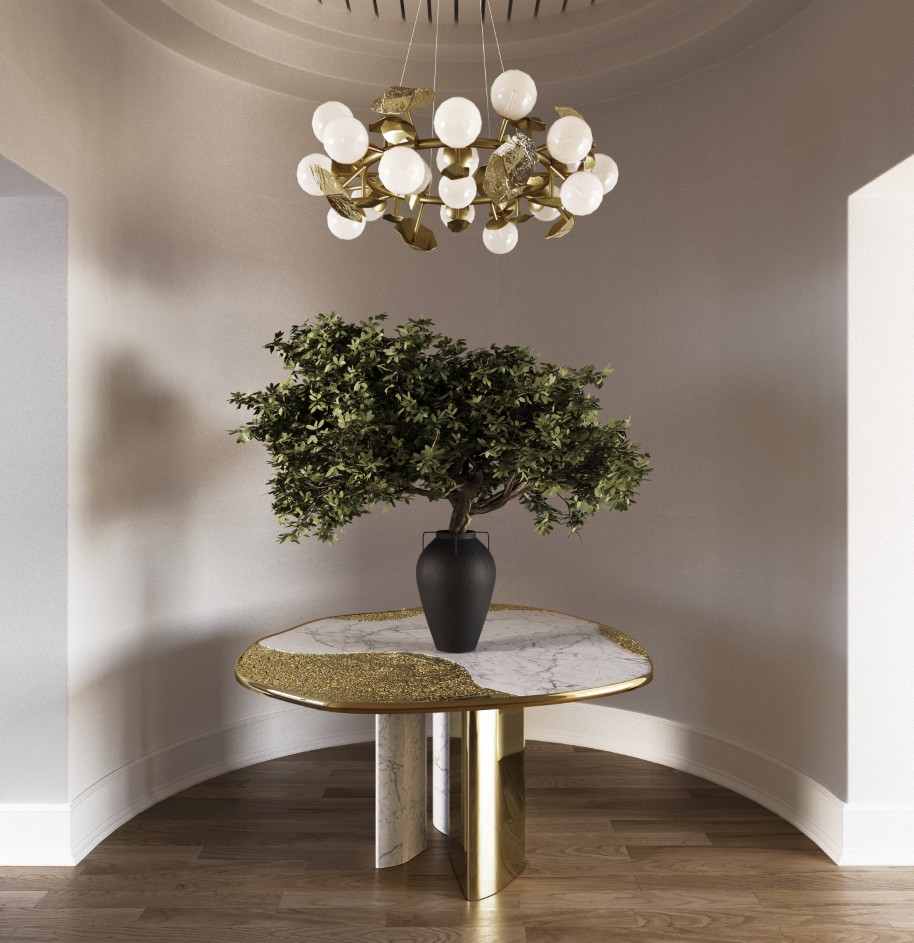 Elegant entrance foyer featuring the Ophelia Round Dining Table with marble and gold finishes, beneath the botanical Hera Round I Suspension Lamp.
