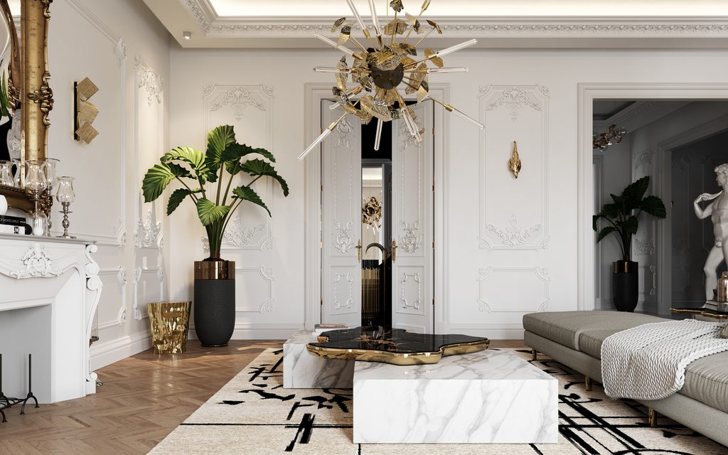 Contemporary Living Room Ideas featuring a luxury marble coffee table with a black and gold centerpiece, elegant white classic moldings on the walls, a grey chaise lounge, and a striking gold chandelier.