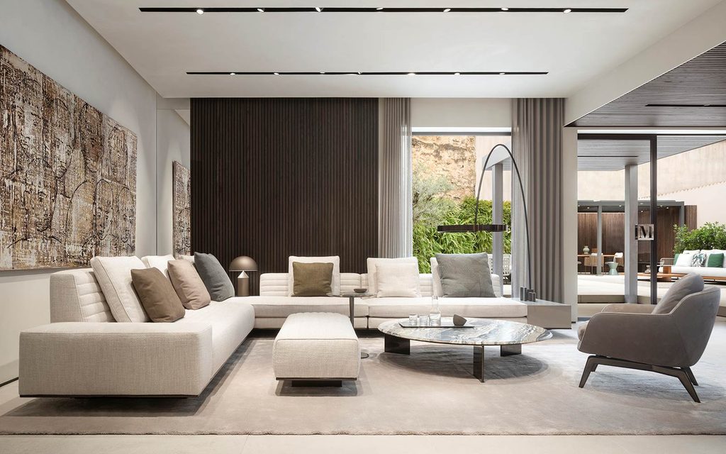 Modern white sectional sofa with stylish dark paneling, luxury showrooms in Palma de Mallorca