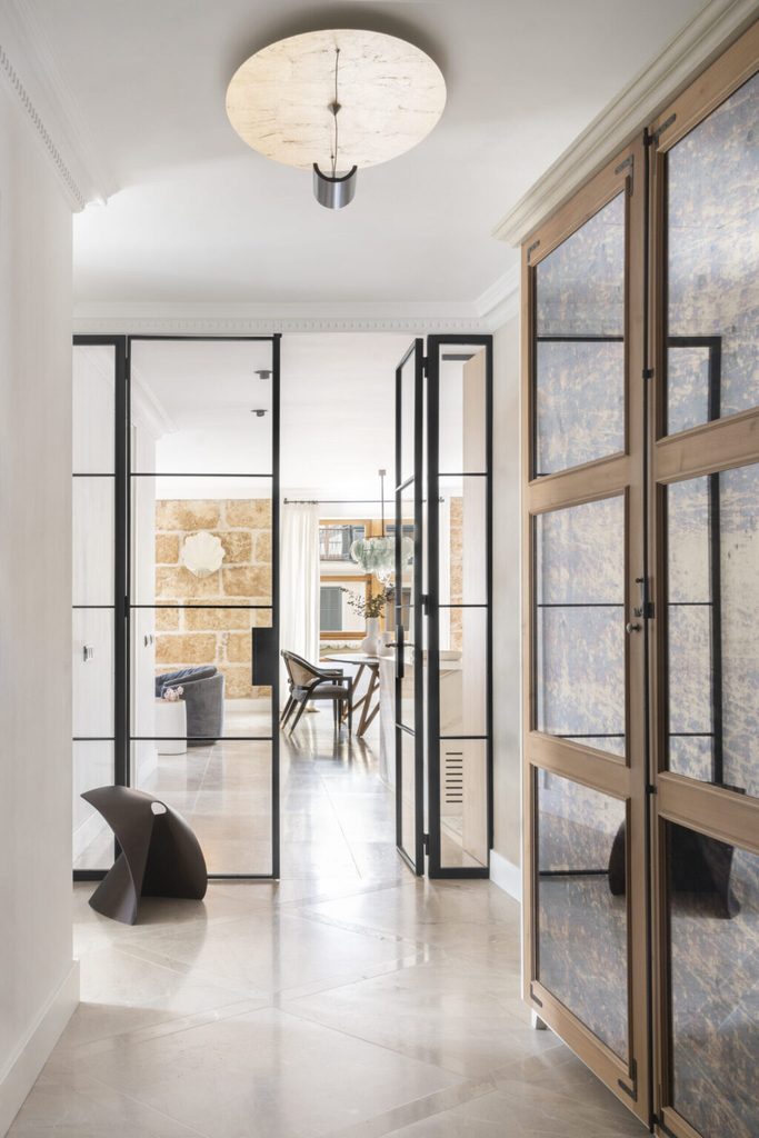 Bright hallway with glass doors and wooden wardrobe, luxury showrooms in Palma de Mallorca