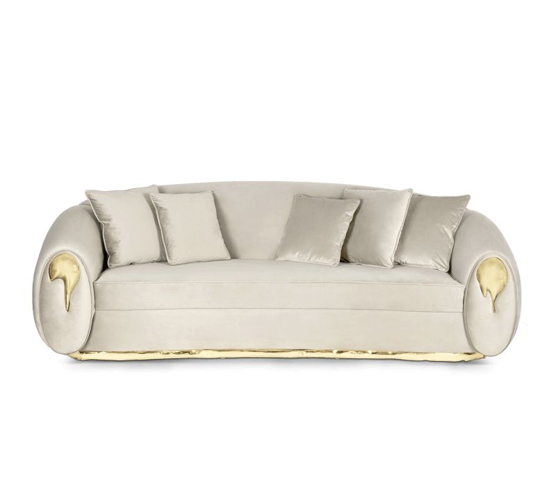 gray sofa with golden detailing
