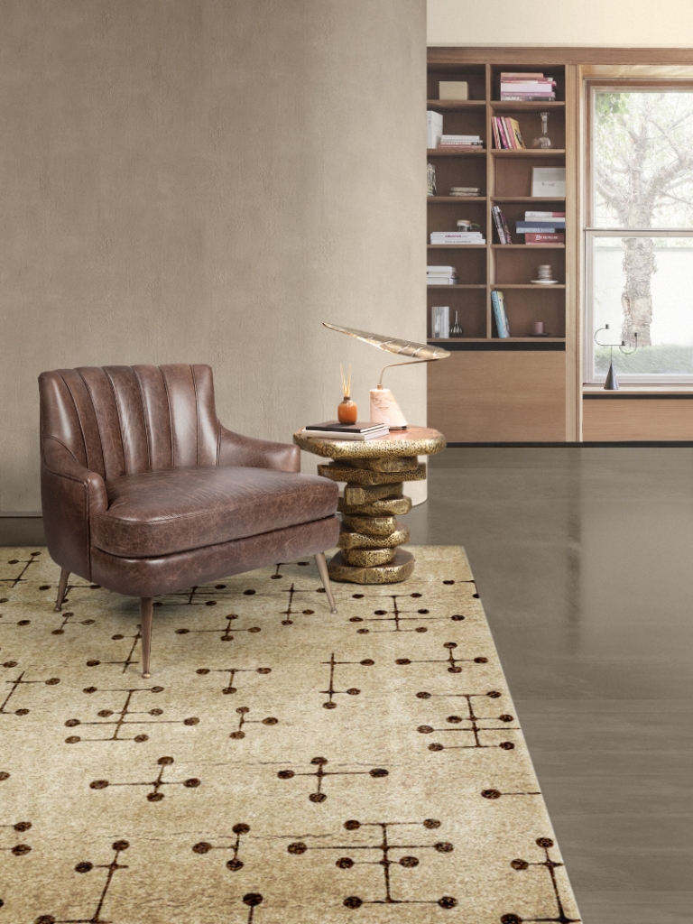 elegant living area corner with a nude chair and a gold side table