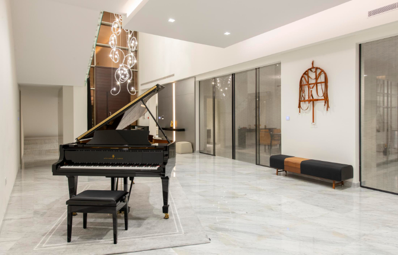 contemporary luxury entryway by olsen & partners with black piano dubai interior design