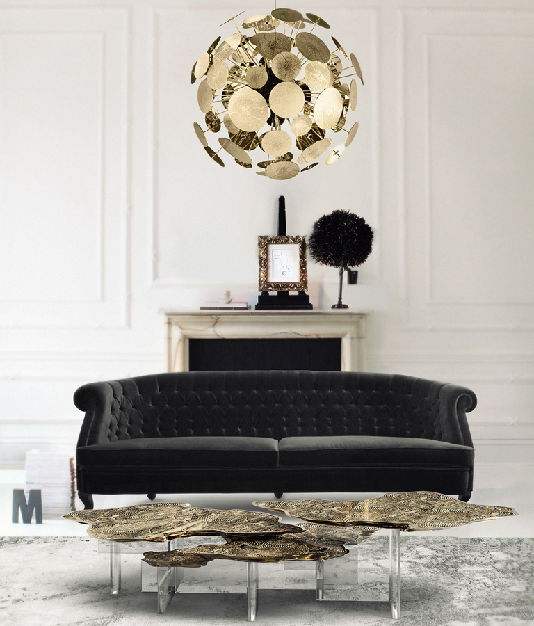 living room with a goden round chandelier and a black sofa