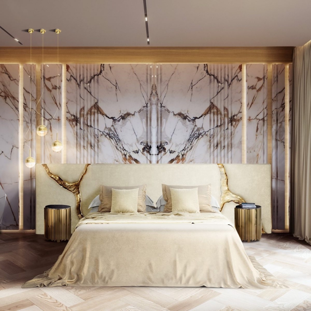 luxury bedroom interior design with a white headboard with golden details, marble wall and nude-toned