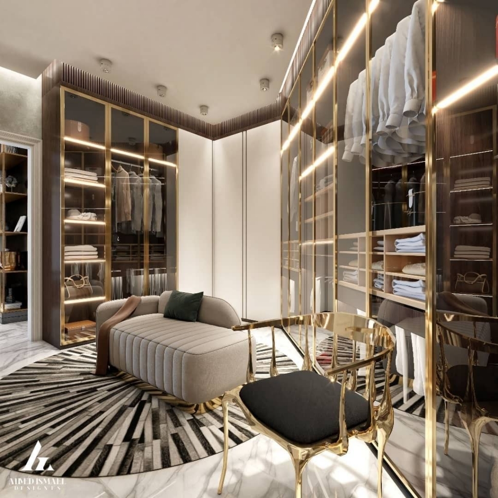 luxury interior design closet with a grey chair, golden wardrobes and a black and white rug with a golden chair with black seat
