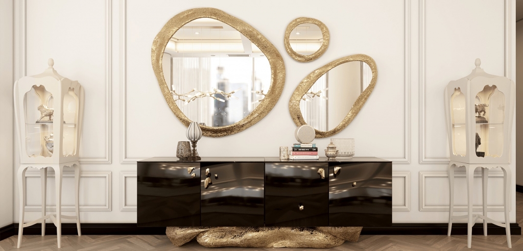 entryway with round mirror and a black sideboard