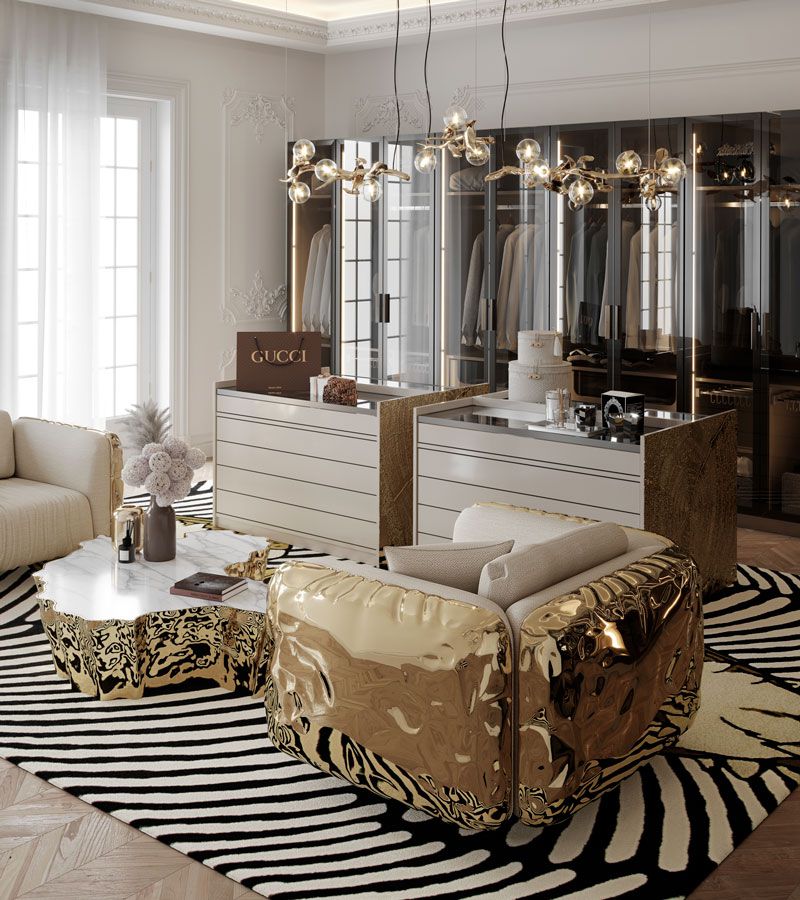 closet with towo beige and golden armchairs, golden center table, and black and white rug