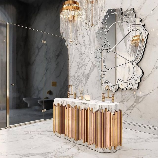marble bathroom with gold bathtub
