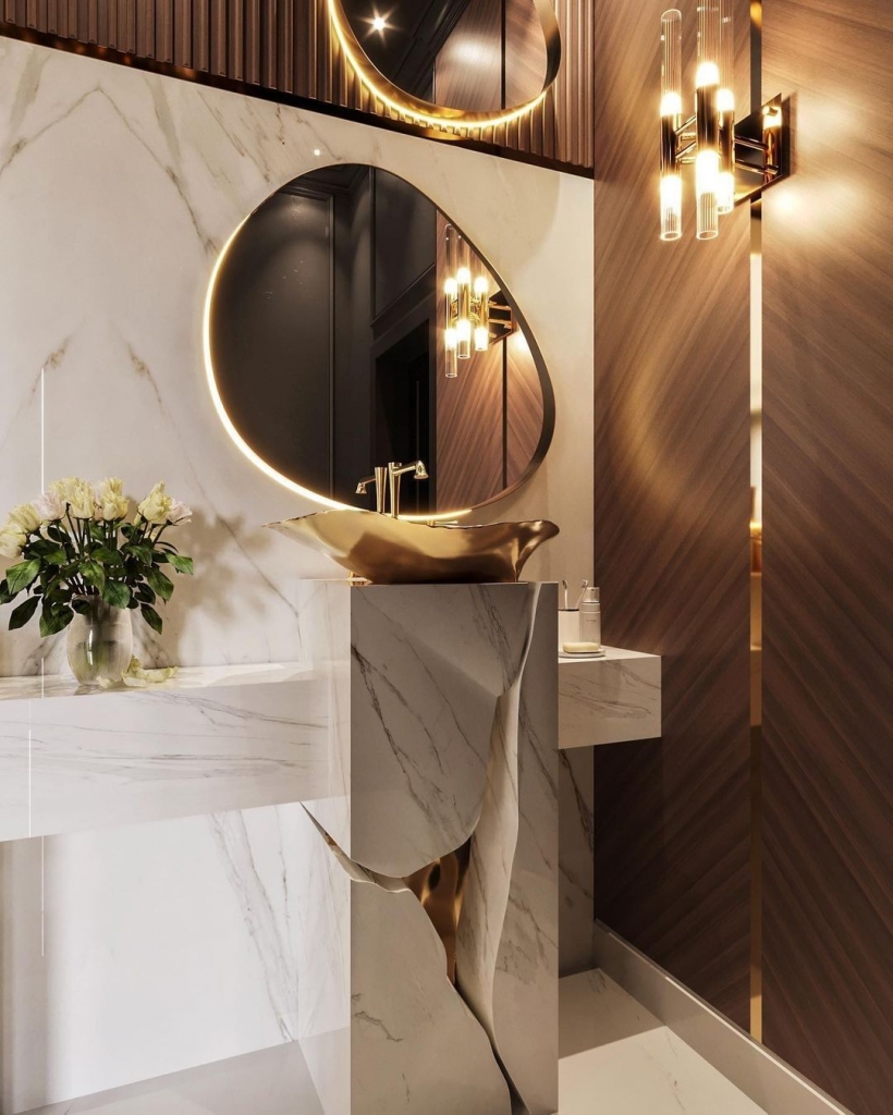 warm bathroom design with a white and gold freestanding