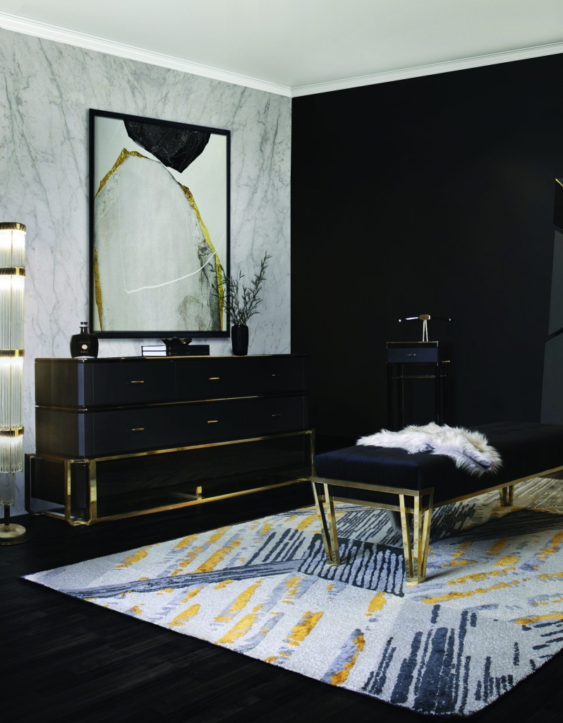 premium designs - luxury dark closet with a black dresser with golden details, a rug and a paint on the wall