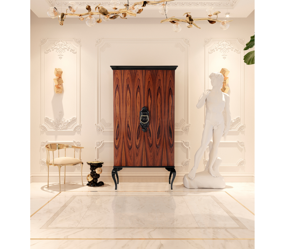 trend alert - brown cabinet with black legs, golden suspension lamp, golden chair with white seat, two golden sconces