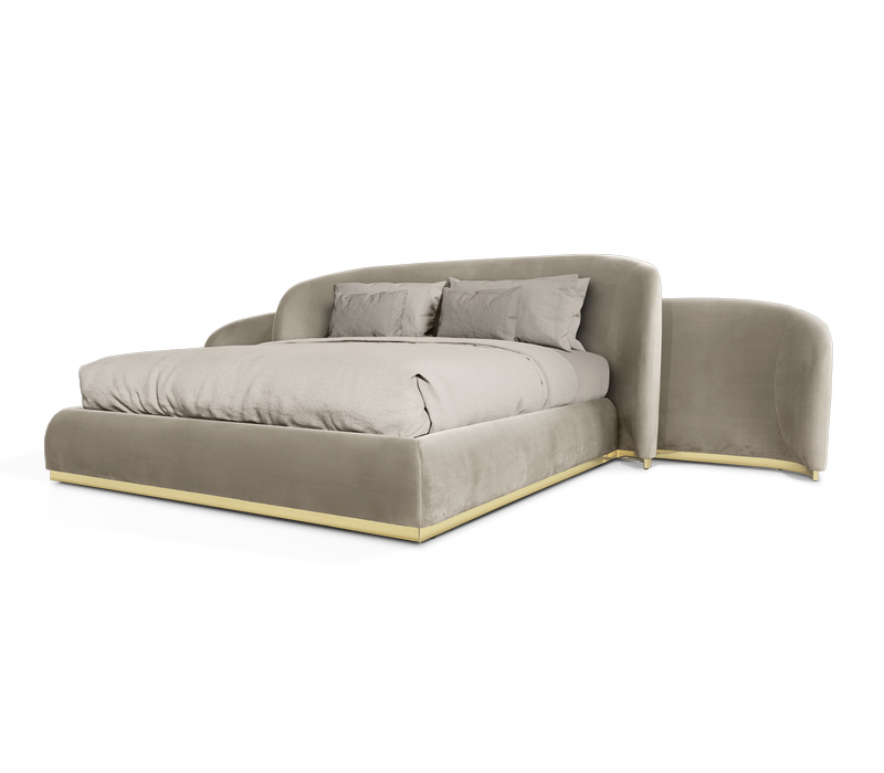 luxury design - king size bed in grey-ish tones with gold detail on the bottom
