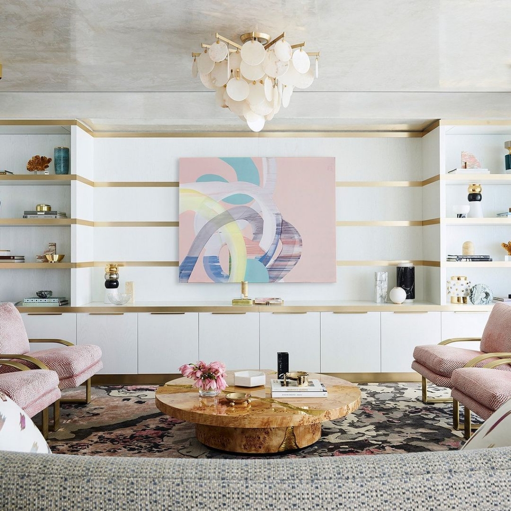 modern living room with a ready to go coffe table and pink armchairs