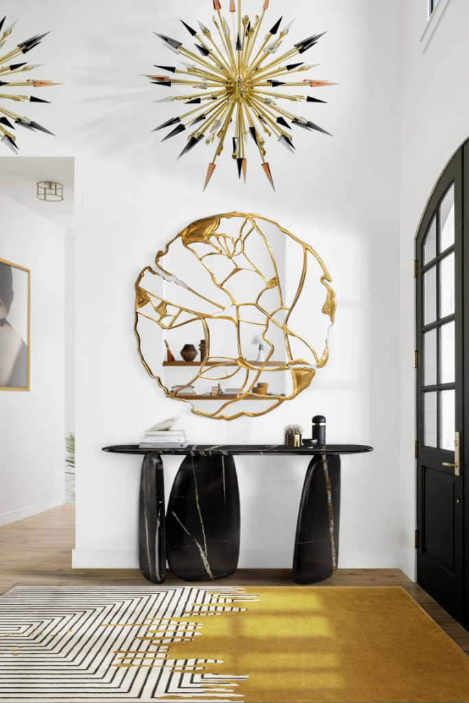 luxury entryway with round mirror ready to go and a black console
