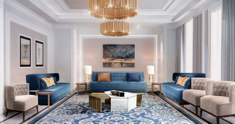 50 luxury center tables - living room with blue and bege sofas, a gold center table with wite marble and a gold chandelier
